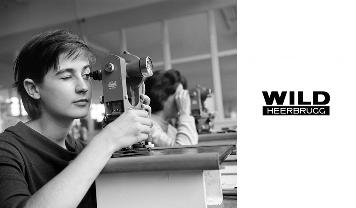 Worker with Wild theodolite and Wild Heerbrugg logo